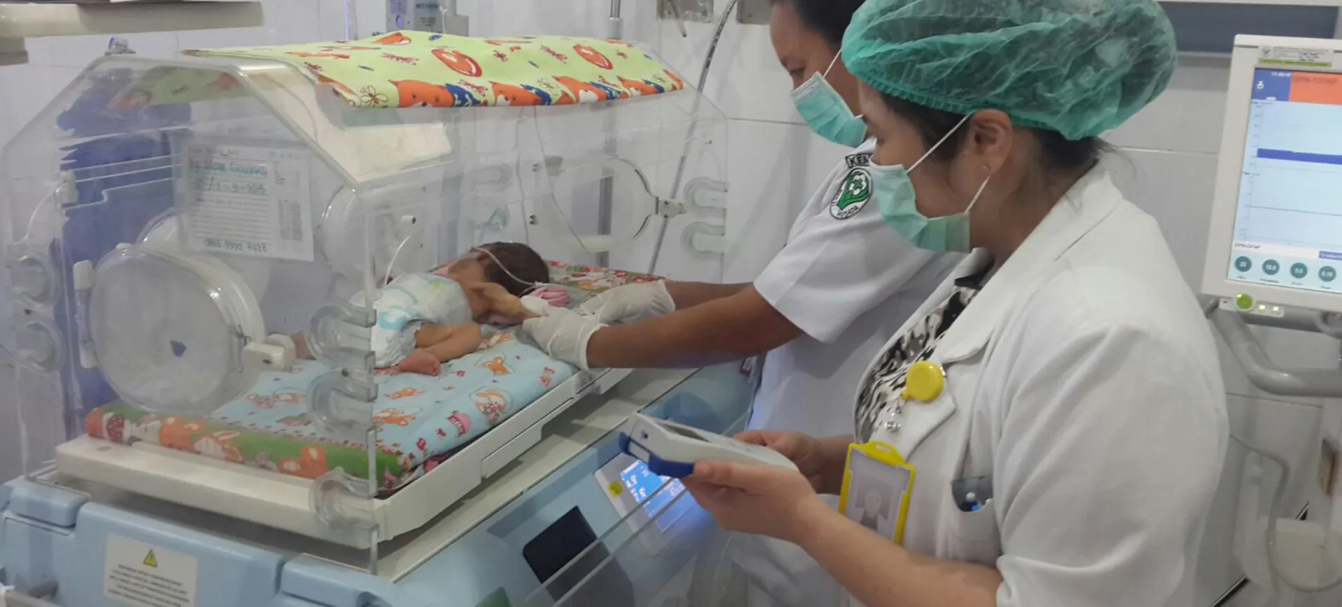 Healthcare professionals with Bilistick in a neonatal unit